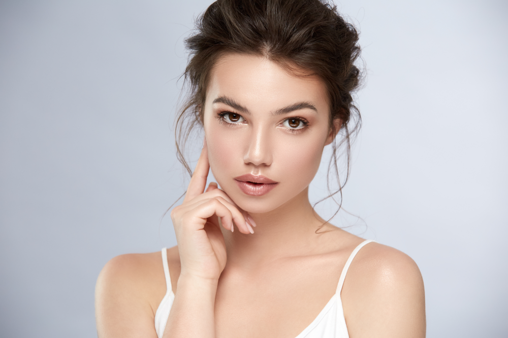Woman with glowing skin after injectables.